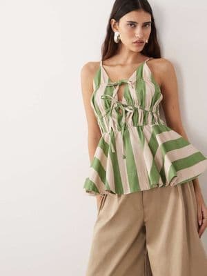 ARRANGE tie front ruched peplum cami top